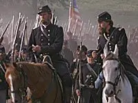 A group of men in uniform on horses.
